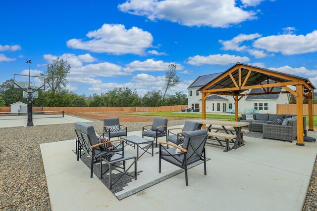 view of patio with outdoor lounge area and a gazebo