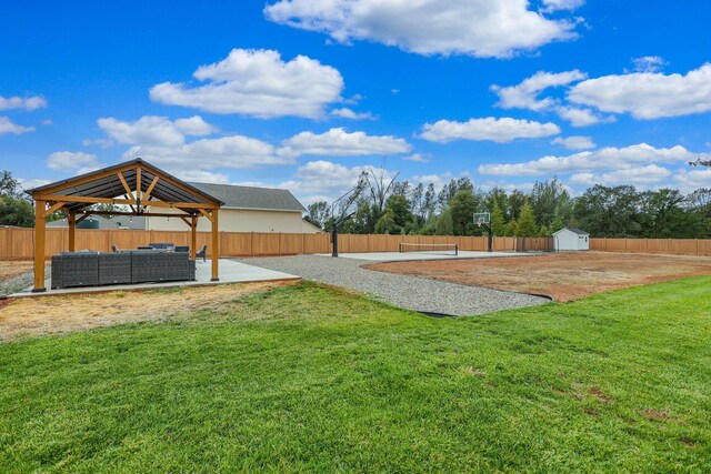 view of yard featuring a gazebo, a storage shed, a patio area, and an outdoor hangout area