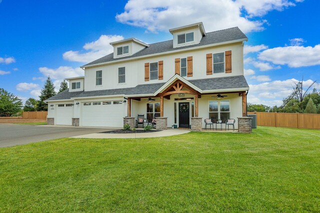 view of front of home featuring a garage, a porch, and a front yard