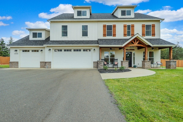 view of front facade featuring a front lawn, a porch, and a garage