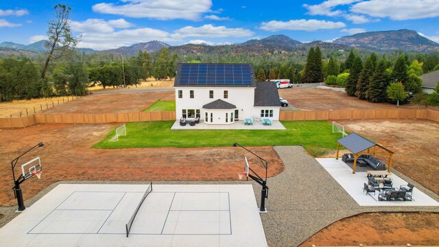 birds eye view of property featuring a mountain view