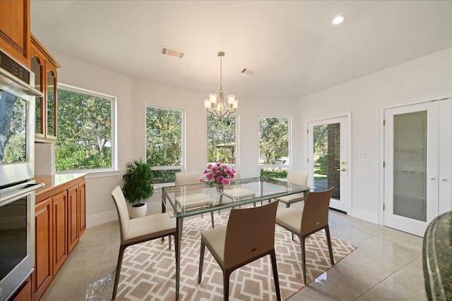 sunroom with a chandelier