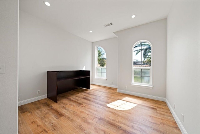 spare room featuring light wood-type flooring