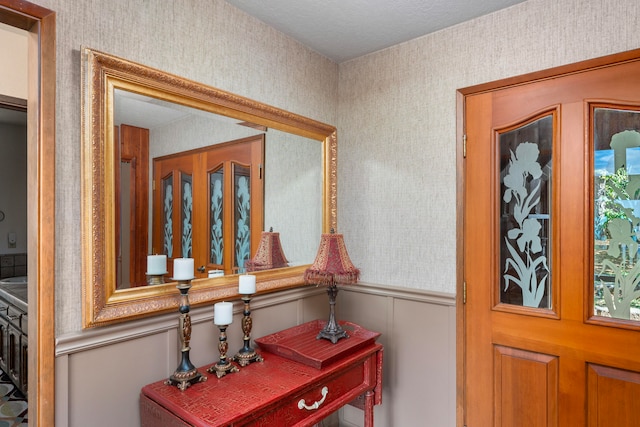 foyer entrance featuring a textured ceiling