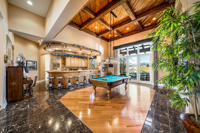 playroom with beam ceiling, coffered ceiling, pool table, bar area, and wood ceiling