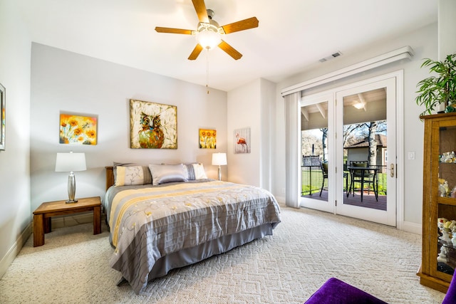 bedroom featuring ceiling fan, light colored carpet, and access to exterior