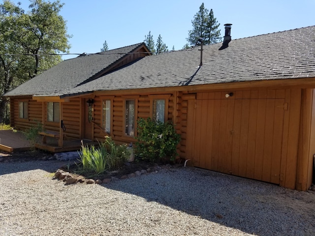 7414 Albers Forest Dr, Shingletown, CA 96088 - back of property with roof with shingles, a deck, and log exterior