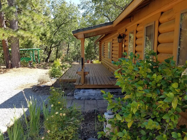 view of home's exterior with a wooden deck