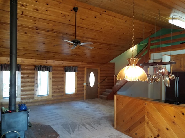 7414 Albers Forest Dr, Shingletown, CA 96088 - interior space with wood ceiling, high vaulted ceiling, a wood stove, and a ceiling fan