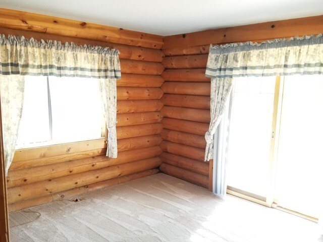 7414 Albers Forest Dr, Shingletown, CA 96088 - empty room with rustic walls