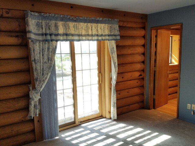 interior space featuring a wealth of natural light and rustic walls