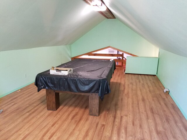 playroom with billiards, light hardwood / wood-style floors, and vaulted ceiling