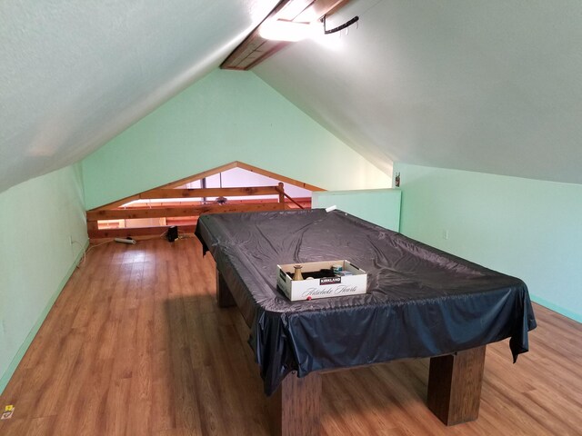 recreation room featuring lofted ceiling with beams, pool table, and hardwood / wood-style flooring