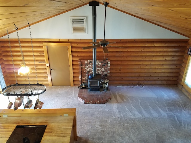 7414 Albers Forest Dr, Shingletown, CA 96088 - unfurnished living room featuring high vaulted ceiling, a wood stove, log walls, visible vents, and ceiling fan