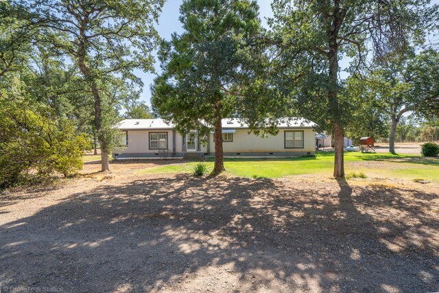 ranch-style home with a front yard