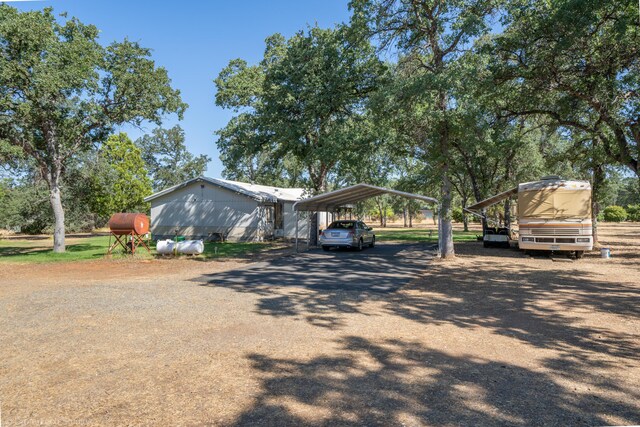 view of side of home featuring a carport