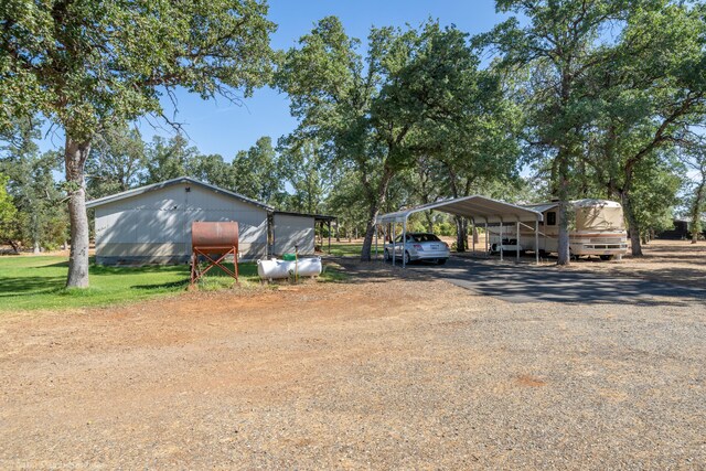 view of yard featuring a carport