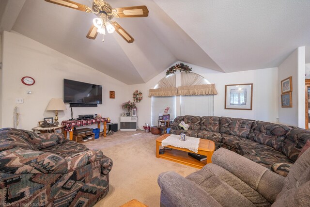 carpeted living room featuring ceiling fan and vaulted ceiling