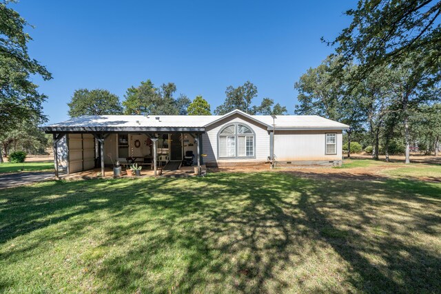 view of front facade featuring a front yard and a patio area