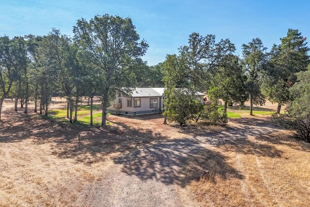 view of yard with a rural view