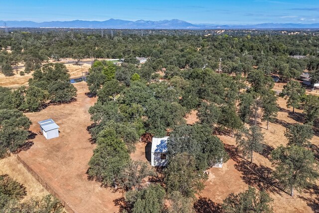 birds eye view of property featuring a mountain view