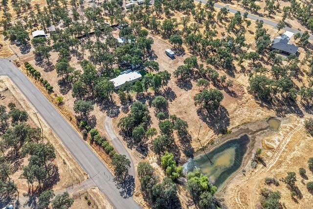 birds eye view of property with a rural view