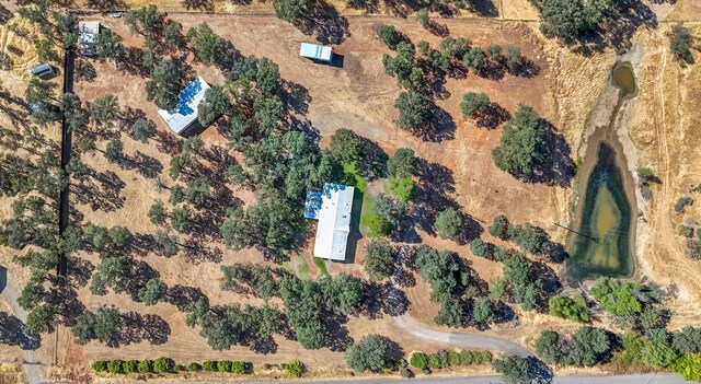 birds eye view of property featuring a rural view