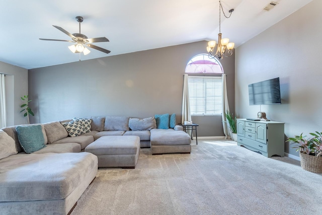 living room featuring vaulted ceiling, ceiling fan with notable chandelier, light carpet, and visible vents