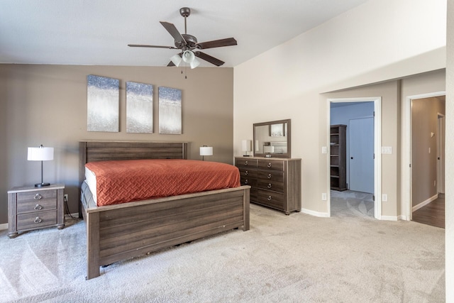 bedroom with a ceiling fan, baseboards, vaulted ceiling, and carpet flooring