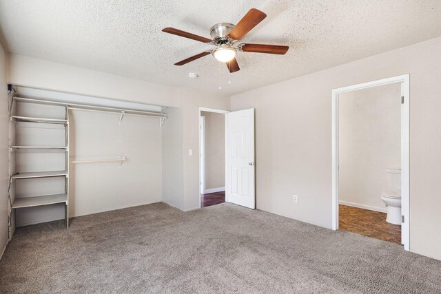 unfurnished bedroom featuring a closet, ceiling fan, a textured ceiling, and carpet floors