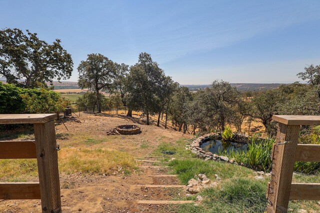 view of yard with a rural view