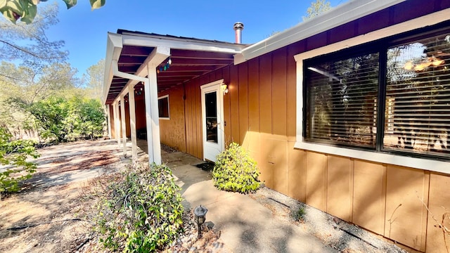 view of side of property with a patio