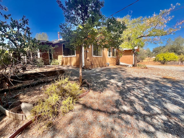 view of property hidden behind natural elements