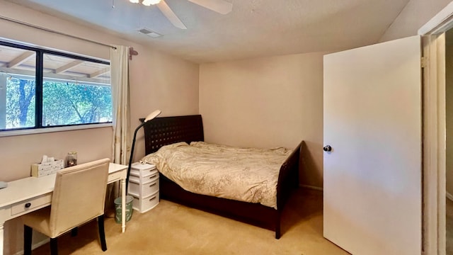 carpeted bedroom with ceiling fan