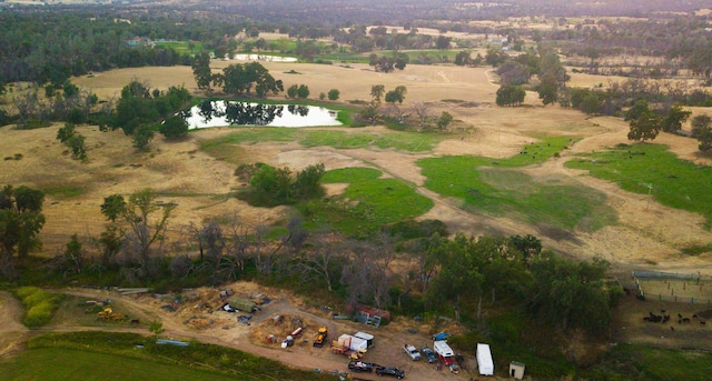 aerial view with a water view and a rural view