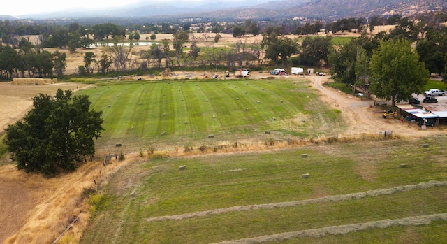 birds eye view of property featuring a rural view