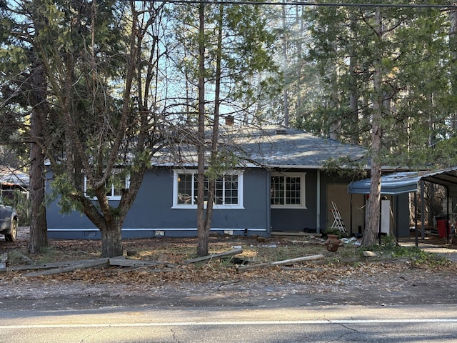 view of front of home with a carport