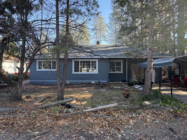 view of front of property with a detached carport