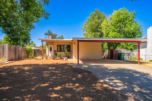 view of front of home with a carport