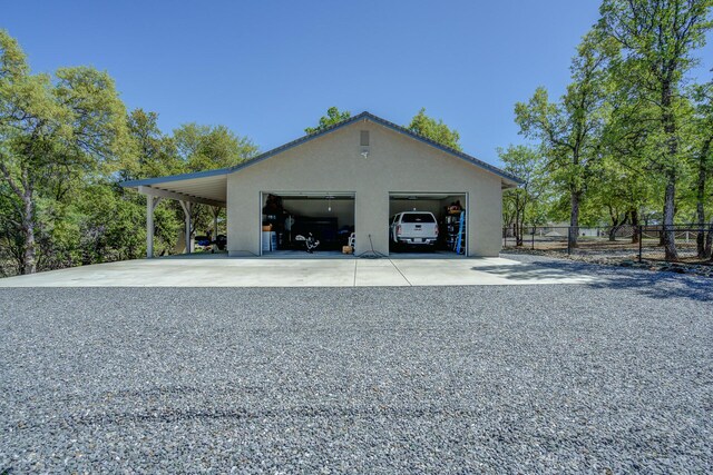 garage featuring a carport