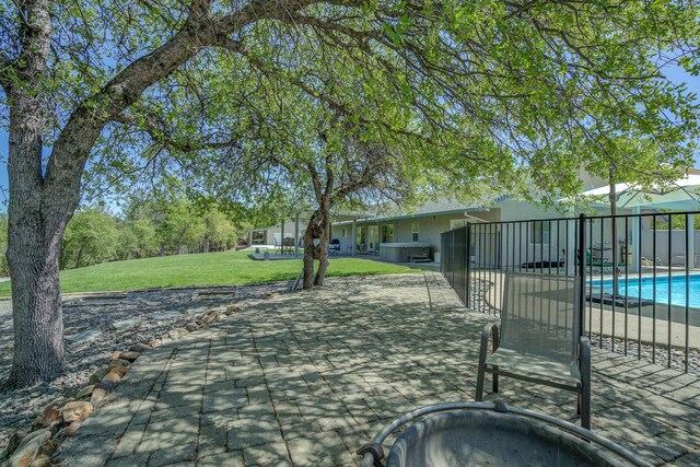 view of patio featuring a fenced in pool