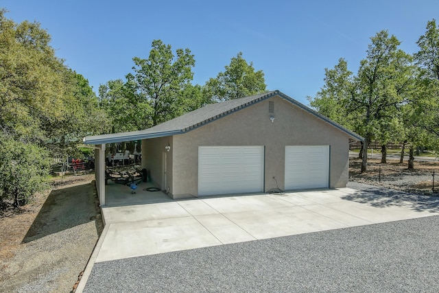 garage with a carport