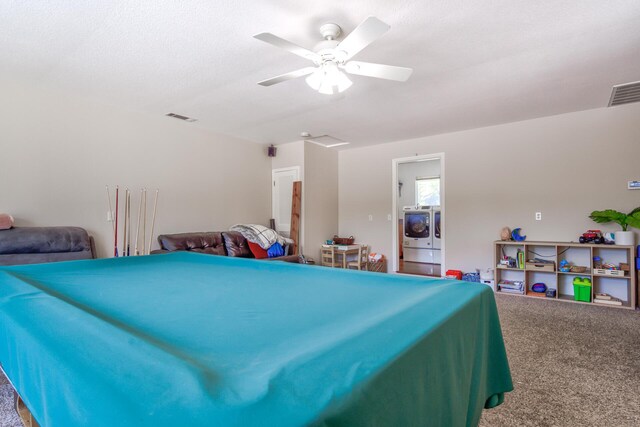 interior space featuring washer and clothes dryer, ceiling fan, and carpet floors