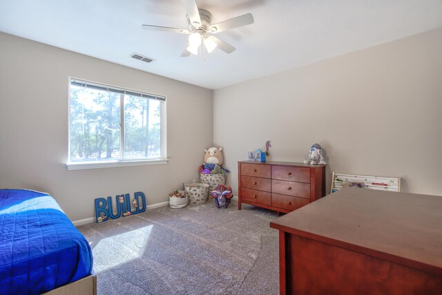 bedroom featuring light colored carpet and ceiling fan