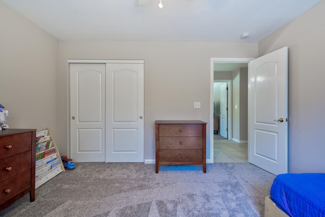 carpeted bedroom featuring a closet