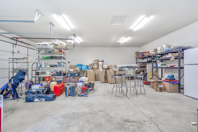 garage with white fridge