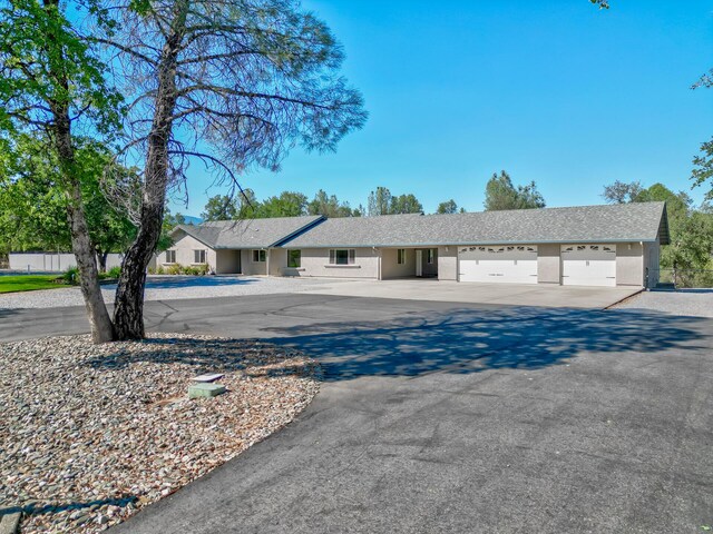 ranch-style home featuring a garage