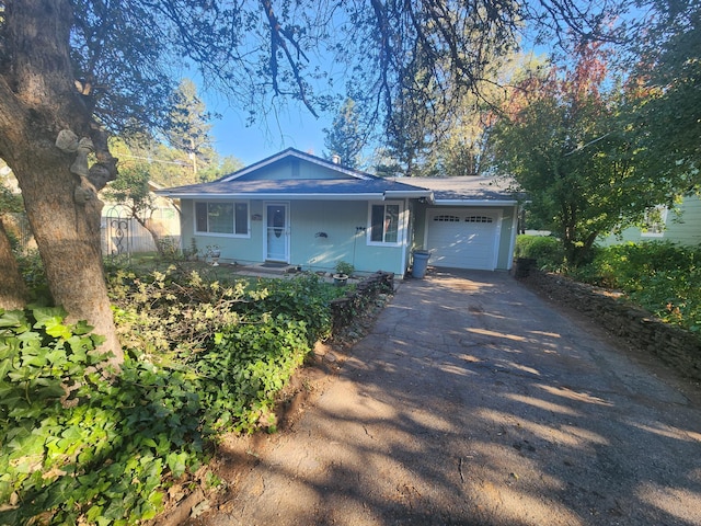 view of front of property with a garage and covered porch