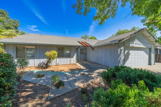 single story home featuring a garage