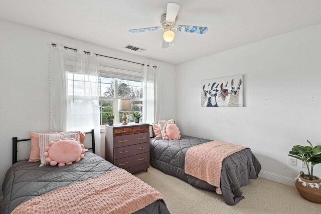 carpeted bedroom with ceiling fan